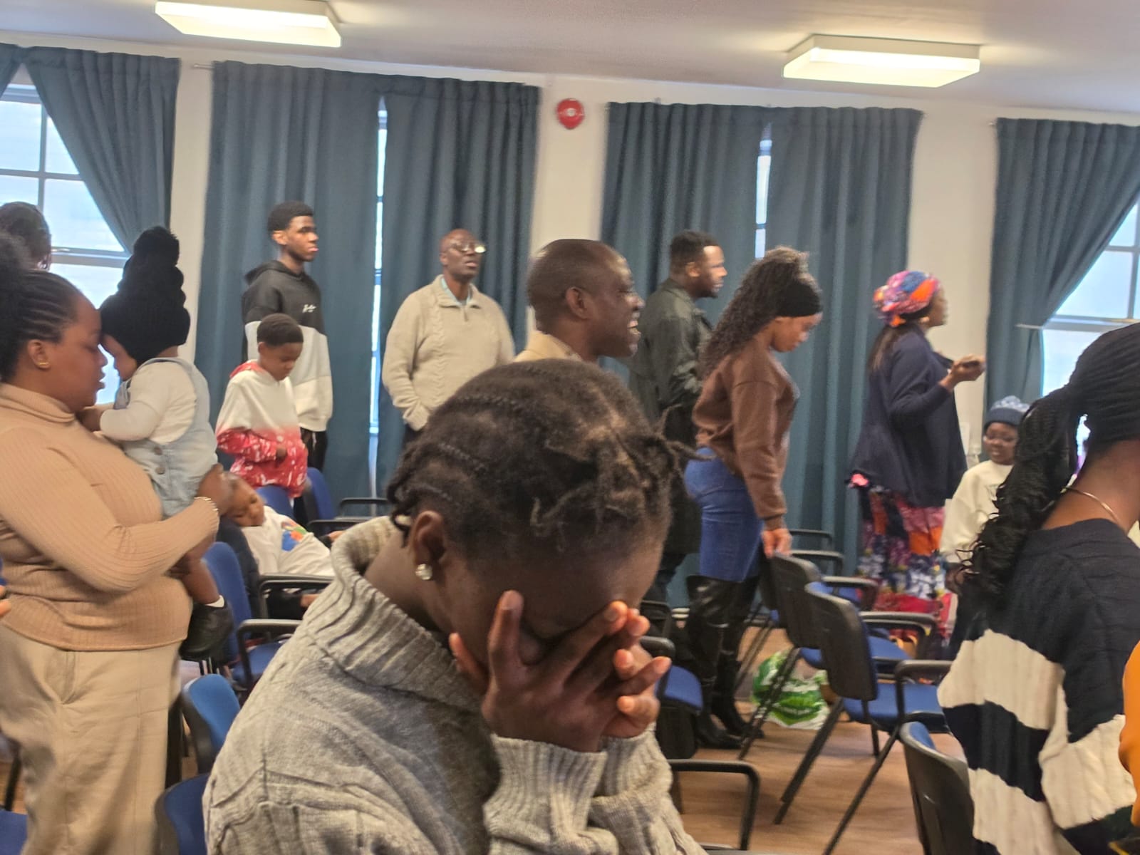 Members in prayer during a Grace Church Keighley service